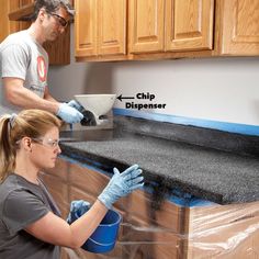 a man and woman are working on a counter top