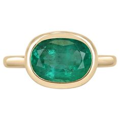 Green Emerald Ring With Oval Cabochon Bezel Setting, Emerald Bezel Set Oval Cabochon Ring, Oval Polished Emerald Ring In 14k Gold, Oval Emerald Ring With Polished Finish In 14k Gold, Oval Emerald Ring In 14k Gold With Polished Finish, Oval Emerald Ring With Bezel Setting, Modern Oval Green Jewelry, Oval 14k Gold Emerald Ring, Oval Emerald Ring With Polished Finish In Yellow Gold