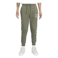 Men's Nike Printing Brand Logo Solid Color Lacing Bundle Feet Casual Sports Pants/Trousers/Joggers Autumn Green DJ0468-380 Nike Cotton Joggers For Leisure, Nike Cotton Jogging Pants, Nike Joggers With Ribbed Waistband For Jogging, Nike Leisure Joggers With Ribbed Waistband, Nike Sporty Tapered Leg Joggers, Nike Cotton Activewear Long Pants, Nike Jogging Pants With Ribbed Waistband, Nike Joggers For Leisure, Nike Gym Pants With Ribbed Waistband