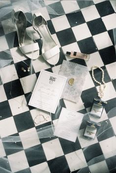 wedding items laid out on a checkered floor