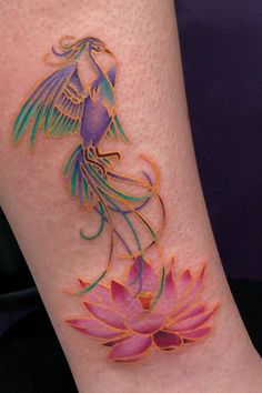 a woman's leg with an artistic tattoo design on the side of her body