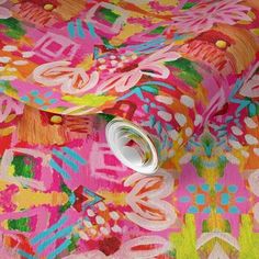 an artistically designed wallpaper with bright colors and designs on the fabric, which is very colorful