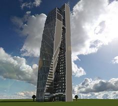 a very tall building sitting on top of a lush green field under a blue cloudy sky