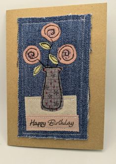 a handmade birthday card with flowers in a vase