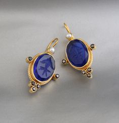 Description Gemstone} - Indigo Blue Glass Metal} - BRASS Gemstone Size - 13X18 mm Earring Height Including Hoop - 4.5 cm Earring Width - 2.5 cm Finish - Smooth and high polished with brilliant shine. {Note} -The earrings are made to order, production day is about 3-5 working days. The one you receive may be slight different from the one in the picture due to handmade nature, but it will be almost same as in the above picture.These pieces are handcrafted from start to finish and have an imperfect handmade look.These earrings are the perfect addition to your collection. Our rings are meant to be classic enough for everyday wear or to give as a bridesmaid gift. Natural stones may vary slightly in shape, size and color.Handmade Item You will receive the same piece as in the picture or identica Jewlery Rings, Silver Jewlery, Cotton Blends Dress, Earrings Vintage, Indigo Blue, Bridesmaid Gift, Vintage Earrings, Blue Glass, Clear Crystal