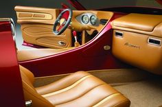 the interior of a classic car with leather seats