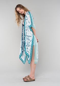 [Color: Ivory/Teal] A side facing image of a blonde model wearing a mid length bohemian kimono in an ivory and teal paisley and floral print. With half length kimono sleeves Bohemian Style Design, Affordable Boho, Bohemian Kimono, Floral Print Kimono, Kimono Sleeves, Warm Spring, Boho Kimono, Paisley Floral, Kimono Sleeve