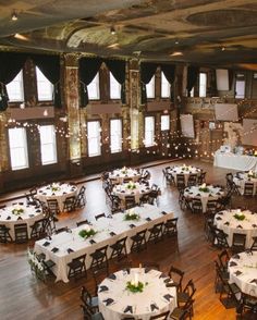 a large banquet hall with tables and chairs