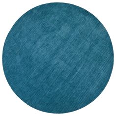 a blue circular rug on a white background