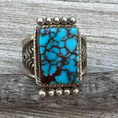 Sterling silver with Kingman turquoise  The top of the ring measures about 1" x 5/8"  Ring size 11  Handmade by Navajo artist, Adrienne Gordon, signed and marked sterling  Close up photos have been taken.  Some items may appear larger than they actually are.  Please take the time to review the photos and measurements before purchasing.    Exported By ExportYourStore :) SKU:457252123772_65C9* Rectangular Turquoise Gemstone Ring, Rectangular Turquoise Jewelry For Collectors, Artisan Turquoise Rectangular Jewelry, Collectible Rectangular Turquoise Jewelry, One Of A Kind Artisan Rectangular Jewelry, One Of A Kind Rectangular Artisan Jewelry, Artisan One-of-a-kind Rectangular Jewelry, Collectible Blue Turquoise Inlay Ring, Southwestern Style Adjustable Rectangular Jewelry