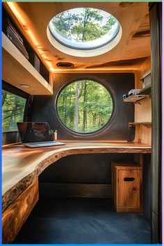 the inside of a tiny house with a round window