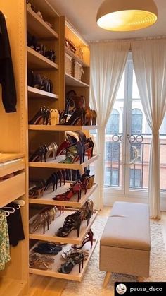 the closet is filled with many pairs of shoes