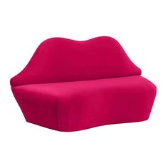 a pink couch sitting on top of a white floor next to a red chair cushion