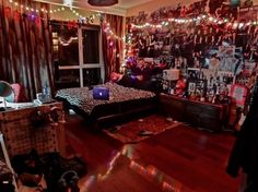 a bedroom decorated with lights and pictures on the wall