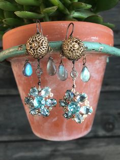 These earrings began with a pair of vintage Aqua rhinestone pieces that look like snowflakes. From them, drops vintage crystal links and vintage filigree pieces, and beautiful labradadorite briolettes. These earrings are One of a kind! Drop 2/12 from bottom curve of the ear wires Vintage Crystal Drop Earrings For Jewelry Making, Unique Filigree Earrings For Wedding, Antique Silver Jeweled Earrings, Vintage Jeweled Drop Earrings, Vintage Jeweled Crystal Earrings For Gift, Unique Dangle Chandelier Wedding Earrings, Unique Dangle Chandelier Earrings For Wedding, Victorian Jeweled Earrings Gift, Vintage Jeweled Dangle Crystal Earrings