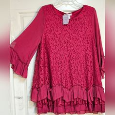 Condition: New With Tag Round-Neck Long Tunic Top With Ruffle Trimmed Elbow Loose Sleeves, Three Layer Ruffle Trimmed Hem. Loose A-Lineish Tunic Type...Hand Washable...Rayon/Polyester Red...Size Large Sheel: 68% Rayon 32% Polyester Lining: 100% Polyester Made In China Chic Long Sleeve Holiday Blouse, Chic Holiday Tops For Spring, Chic Flowy Red Blouse, Chic Red Flowy Blouse, Red Lace Top For Spring, Elegant Red Lace Top, Feminine Red Blouse For Fall, Casual Spring Holiday Blouse, Chic Holiday Blouse For Spring