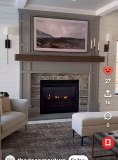 the living room is decorated in neutral colors and features a fireplace with an art piece above it