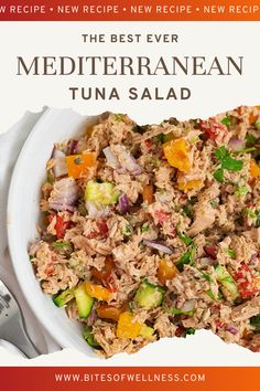 the best ever mediterranean tuna salad recipe in a white bowl with spoons next to it