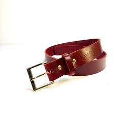 Are you looking for a beautiful, classic and versatile quality women's leather belt? This minimalist leather belt  will complement both your dressy and casual outfits. You will be pleased by its classic look buckle, red cherry shiny finish leather and timeless style.  Leather and hardware: This belt is handcrafted with buffalo leather that has a beautiful lustrous finish. Buffalo leather is extremely strong and will evolve over time. It's the perfect gift idea for your girlfriend, valentine's da Classic Leather Belt Buckles As Gift, Classic Leather Belt Buckles For Gifts, Classic Red Belt For Formal Occasions, Leather Belt With Brass Buckle As Gift, Classic Red Formal Belt, Formal Red Leather Belt, Elegant Red Leather Belt, Classic Red Belt Buckles With Removable Belt, Luxury Red Leather Belt