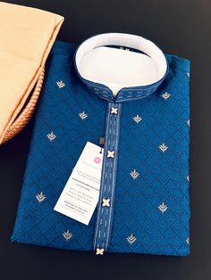 Soft and Premium quality Soft Silk Kurta Pajama in Peacock Blue color Small zari Butti Weaving with self design embroidery material.  Item : Men's Kurta Pajama Ready to Wear : Yes Kurta Color :  Peacock Blue  Pajama Color : Gold Fabric : Soft Silk (Non-Prue)  Pocket : Yes Lining (Yes/No) : No Disclaimer  -For sizing please refer to the Size Chart given in the listing with the pictures.  - Please do NOT go by the size of the Kurta that you already have from another maker. All makers have differen Traditional Indigo Semi-stitched Kurta, Traditional Indigo Kurta With Dabka, Traditional Semi-stitched Indigo Kurta, Indigo Kurta With Zari Work For Diwali, Festive Indigo Traditional Wear With Dabka, Traditional Indigo Embroidered Kurta, Traditional Embroidered Indigo Kurta, Transitional Blue Kurta For Traditional Ceremonies, Embroidered Indigo Kurta For Transitional Season