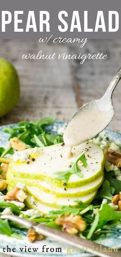 pear salad with creamy dressing and walnuts on a plate