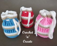 three crocheted baby booties sitting next to each other