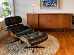 an eames chair and ottoman in a living room