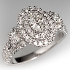 an oval shaped diamond ring with double halos