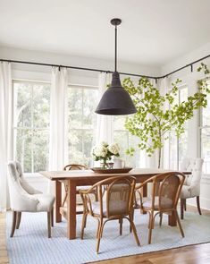 the dining room table is surrounded by chairs