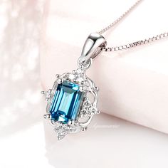 This vintage inspired dainty necklace is made of 925 solid sterling silver using natural London blue topaz.►Great for everyday wear or for any occasion. Beautiful if worn alone or layered. Suitable for all ages. All of our jewelry are handmade. Every gemstone is handpicked for the best quality.►Chain length: 18" ( +2" extender)►Chain type: boxCenter Stone: TopazColor: London BlueShape/Cut: Emerald Gem size: 6.0 x 4.0 mmCarat Weight: 1 ct. (approx.)Gemstone creation: NaturalHardness: 8.5Accent st London Blue Topaz Necklace, London Blue Topaz Earrings, Popular Engagement Rings, Blue Topaz Necklace, Topaz Color, Topaz Necklace, Blue Topaz Earrings, Creating Jewelry, Wedding Ring Designs