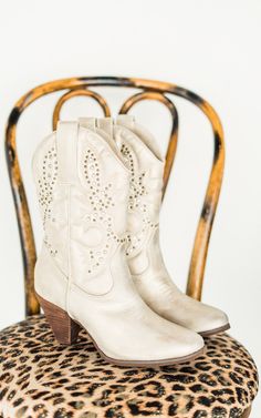 Bring the spirit of the Wild West into the modern era with these crisp champagne cowboy boots. Perfect for festivals, nights out, or even a quick line dance in the living room—because why not? Details Chic western inspired boot Faux leather upper in a crisp champagne hue with bronze studs Almond toe 3 inch heel height Fit true to size. If between sizes, size up. Brand: Naughty Monkey Colored Boots, 3 Inch Heels, Judy Blue Jeans, Jewelry Bags, Business Fashion, Shoe Box, Western Boots, Sale Items, Houston