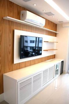 a flat screen tv mounted to the side of a wall