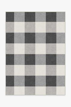 a gray and white checkered rug with black squares