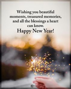 someone holding a sparkler in their hand saying wishing you beautiful moments, treasures memories, and all the blessing a heart can know happy new year