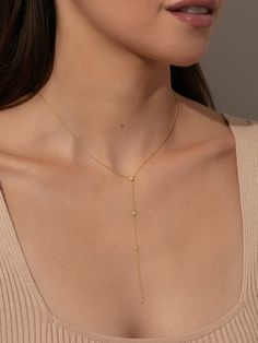 Want the perfect layering necklace? Our Shiner Lariat Vermeil Necklace is the one. Crafted with 18k gold over sterling silver and real, slightly included round-cut diamonds, this Y-shaped necklace brings a shiny, luxurious touch to your look. Pair this dainty chain necklace with your other favorite gold Vermeil jewelry styles for a look that’s glamorous and effortless. Elegant Gold Drop Necklace For Layering, Elegant Yellow Gold Lariat Necklace For Layering, Dainty Yellow Gold Backdrop Necklace With Clavicle Chain, Minimalist Yellow Gold Backdrop Necklace With Clavicle Chain, Fine Jewelry Yellow Gold Backdrop Necklace With Delicate Chain, Dainty Long Drop Jewelry For Layering, Delicate Chain Necklaces For Layering, Delicate Chain Long Drop Necklace For Layering, Adjustable Chain Necklace For Layering