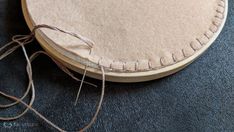 a close up of a round object on the ground with some string attached to it