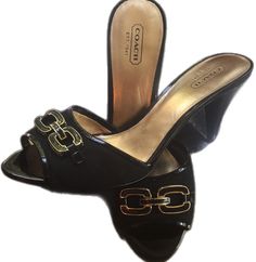 Classic Coach Sandals For Summer, Chic Slip-on Coach Heels, Classic Coach Heels For Spring, Coach Sandals For Spring Formal Occasions, Coach Mules For Spring, Coach Heels With Buckle Closure, Coach Closed Toe Formal Sandals, Formal Coach Synthetic Sandals, Coach Elegant Formal Sandals