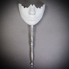 Unpainted lower half-face hand-held stick masks are a versatile and affordable option for masquerade parties, costume events, and other types of fancy dress events. These masks come in a classic white and silver color stick combination, and feature a design that covers the lower half of the face. The mask is held in place using a stick that is attached to the bottom, allowing for easy and comfortable wear. These unpainted masks offer a blank canvas for those who want to get creative and add thei Bottom Half Mask, Lower Face Mask, White Masks, Wax Studio, Unique Masks, Half Mask, Half Face Mask, White Mask, Cool Masks