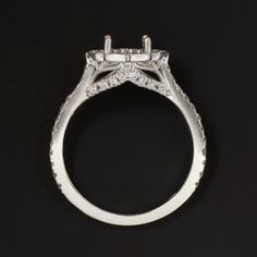 a white gold engagement ring with diamonds on it