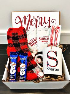 a christmas gift box filled with candy, coffee and marshmallows