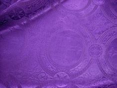 a purple cloth with intricate designs on it