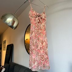 Vintage 90/00's silk paisley floral dress.  So cute with adjustable tie detail at the bust which is super flattering on the chest.  Size 4 and best for an xs/small.  Was very tight in my chest area and I am a small/medium.  100% silk outer with polyester lining.  I am 5'4 for reference! Fitted Silk Dress With Paisley Print, Summer Silk Dress With Paisley Print, Silk Fitted Dress With Tie Straps, Fitted Silk Dresses With Tie Straps, Fitted Paisley Print Midi Dress For Beach, Fitted Paisley Print Sundress, Vintage Summer Dress With Paisley Print, Piper Halliwell, 2000s Dress