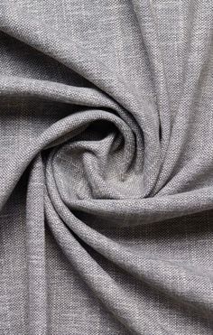 a close up view of the fabric on a grey shirting material that is very soft