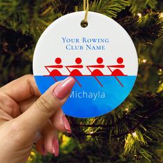 a personalized ornament for rowing team hanging from a christmas tree with the name your rowing club name