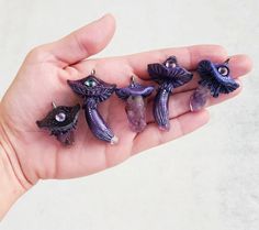 a hand is holding five small figurines in it's palm, with the words shop update in progress