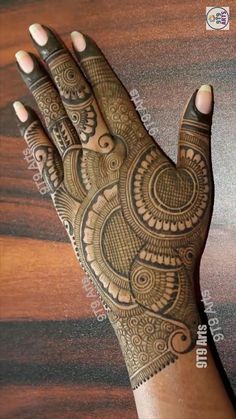 the hand is decorated with intricate designs