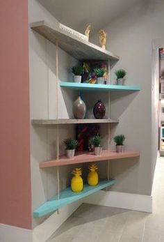 some shelves with plants and vases on them