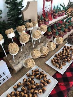 there are many desserts on the table for people to eat at this holiday party