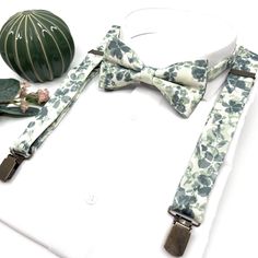 "Floral Sage Green Suspenders, Floral Sag Bow tie, Suspender Bowtie, Wedding Floral Suspenders, Groomsmen Suspenders, Ring bearer outfit Welcome to Justformanboutique! It is a wonderful set that I have prepared completely handmade from first quality fabric and you will not find it in any other store. Please message me if you would like more information about this suspenders and bow tie set that will make you feel unique on your most special days.  If you want to buy the tie of the same product, Fitted Suspenders For Groom Suit And Tie Accessories, Dapper Suspenders For Wedding, Dapper Wedding Suspenders, Groom's Bow Tie With Suspenders, Summer Bow Tie For Groom, Sage Green Suspenders, Floral Suspenders, Suspenders Ring Bearer, Suspenders Groomsmen