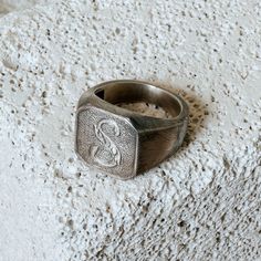 This Vintage Square Monogram Initial Signet Ring was crafted with time and care, handmade from sterling silver and oxidized to add character. Each ring is then individually worn and hammered to give it a rugged aesthetic and vintage feel--forging the charm that it was crafted many years before its time. Handcrafted/handmade from sterling silver with a clean vintage feel. The perfect gift! A gift for your boyfriend or girlfriend or yourself :) This etched for style with its well-worn design - nei Adjustable Engraved Antique Silver Ring, Handmade Sterling Silver Promise Signet Ring, Handmade Sterling Silver Signet Ring For Promise, Antique Engraved Sterling Silver Signet Ring, Antique Sterling Silver Engraved Signet Ring, Heirloom Sterling Silver Signet Promise Ring, Vintage Adjustable Initial Ring, Vintage Adjustable Personalized Signet Ring, Sterling Silver Heirloom Signet Ring For Promise